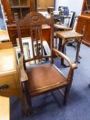 AN EARLY TWENTIETH OAK CARVERS ARMCHAIR