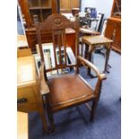 AN EARLY TWENTIETH OAK CARVERS ARMCHAIR