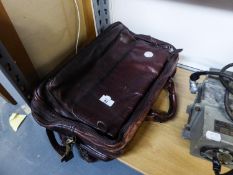 A BROWN HIDE BRIEFCASE