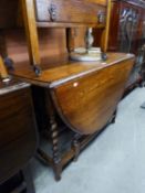 AN OAK OVAL GATE LEG DINING TABLE, ON SPIRAL LEGS