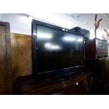 PANASONIC VIERA FLAT SCREEN TELEVISION, ON MAHOGANY FALL FRONT STAND AND THE SYMPHONIC VIDEO