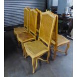 A SET OF SIX LIGHTWOOD DINING CHAIRS WITH CANE BACKS AND SEATS AND 'X' STRETCHER (6)