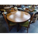 A G-PLAN MCINTOSH STYLE EXTENDING DINING TABLE WITH CIRCULAR TOP (124cm diameter) RAISED ON TAPERING