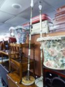 TWO GREEN ONYX AND GILT METAL STANDARD LAMPS AND FLORAL FABRIC SHADES WITH TASSELLED FRINGES