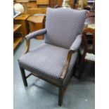 A LARGE UPHOLSTERED ARMCHAIR WITH SCROLL ARMS AND STUD DECORATION, RAISED ON STRAIGHT SUPPORTS