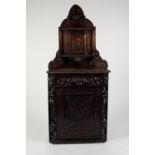 LATE NINETEENTH/ EARLY TWENTIETH CENTURY CONTINENTAL CARVED DARK OAK FLOOR STANDING CORNER CUPBOARD,