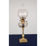 BRASS OIL TABLE LAMP, of slender, panelled baluster form with square, stepped base, cut glass