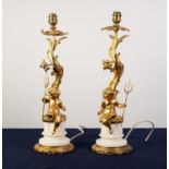 PAIR OF 20th CENTURY GILDED BRASS AND ALABASTER ELECTRIC TABLE LAMPS each with a cherub holding a