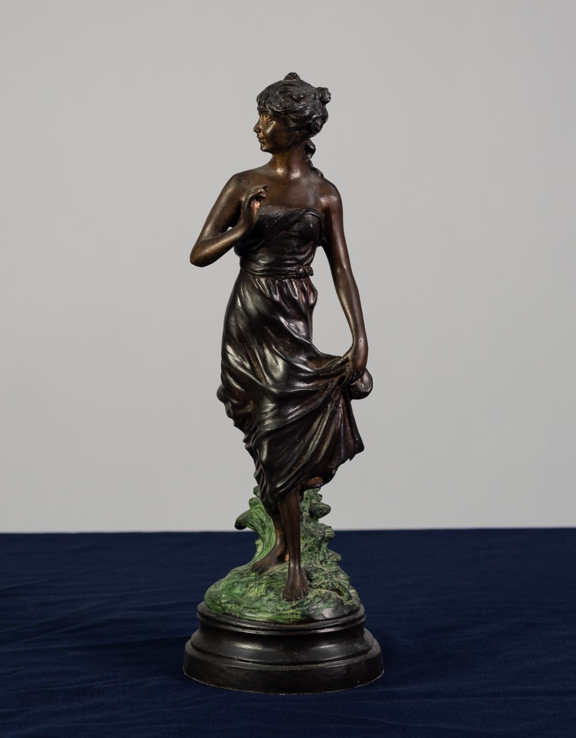 A TWENTIETH CENTURY PATINATED AND COLD PAINTED BRONZE FEMALE FIGURE on combined circular base,