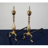 PAIR OF BRASS FIRE DOGS, each of baluster form with finial and scroll supports, 18 ¼? (46.4cm) high,