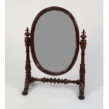 GOOD EARLY NINETEENTH CENTURY CARVED MAHOGANY LARGE TOILET MIRROR, the oval plate within a moulded