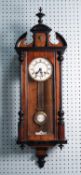 TWENTIETH CENTURY WALNUT AND EBONISED VIENNA STYLE WALL CLOCK WITH SPRING DRIVEN MOVEMENT, the two