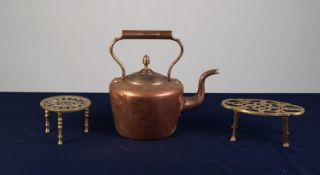 VICTORIAN COPPER KETTLE AND TWO PIERCED BRASS TRIVETS (3)