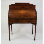 EDWARDIAN LINE INLAID AND FIGURED MAHOGANY CYLINDER BUREAU, the moulded oblong top with short