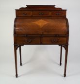 EDWARDIAN LINE INLAID AND FIGURED MAHOGANY CYLINDER BUREAU, the moulded oblong top with short