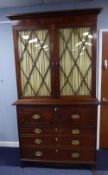 REGENCY MAHOGANY SECRETAIRE BOOKCASE, the moulded cornice above a flame cut frieze and pair of