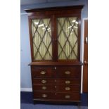 REGENCY MAHOGANY SECRETAIRE BOOKCASE, the moulded cornice above a flame cut frieze and pair of