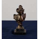 A SMALL TWENTIETH CENTURY PATINATED METAL BUST OF A FEMALE in Art Nouveau taste, on stepped marble