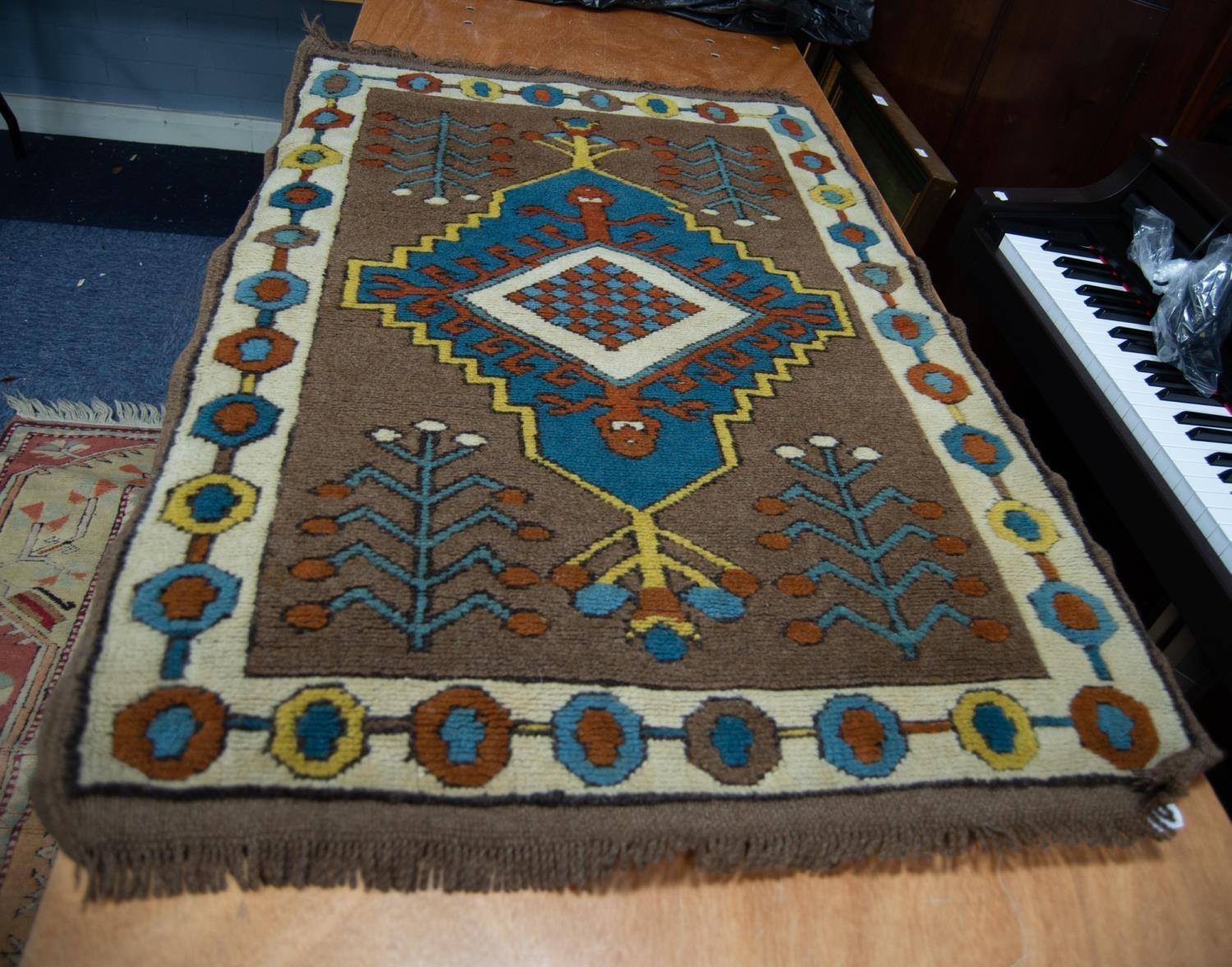 CAUCASIAN STYLE EASTERN RUG having diamond shaped centre concentric medallion with pendants on a