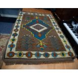 CAUCASIAN STYLE EASTERN RUG having diamond shaped centre concentric medallion with pendants on a