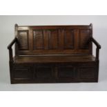 EIGHTEENTH CENTURY OAK BOX SETTLE, of typical form with five panel back, sloping arms and plank