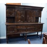 MID/ LATE TWENTIETH CENTURY JACOBEAN STYLE OAK LARGE SIDEBOARD, the canopy back with a central