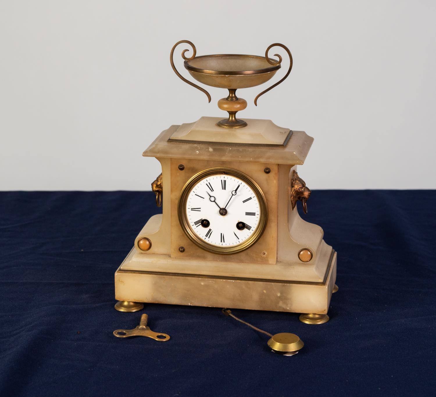 LATE VICTORIAN WHITE ALABASTER AND GILT METAL MANTEL CLOCK, of architectural form with two handle