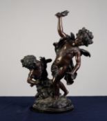 TWENTIETH CENTURY PATINATED COPPER ALLOY GROUP of a young girl and cherub holding a torch, on a