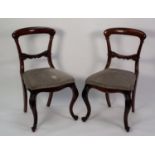 SET OF SIX VICTORIAN CARVED ROSEWOOD SINGLE DINING CHAIRS, each with a curved shoulder board and