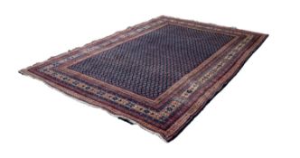 SAROUK PERSIAN LUSTROUS ALL-WOOL HAND KNOTTED CARPET with a dense all-over boteh design on a dark