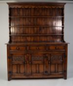 PROBABLY BEVAN FUNNELL, MODERN REPRODUCTION CARVED ELM WELSH DRESSER, the panelled plate rack with