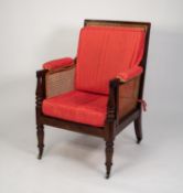 EARLY NINETEENTH CENTURY MAHOGANY BERGERE EASY ARMCHAIR, the square, moulded show wood frame with