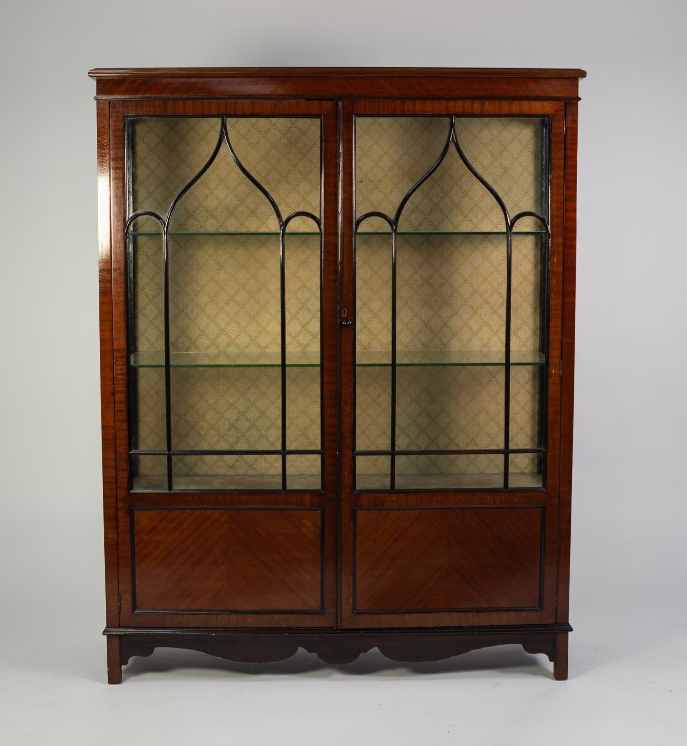 EARLY TWENTIETH CENTURY FIGURED MAHOGANY DISPLAY CABINET, the moulded oblong top above gazed sides