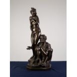 A TWENTIETH CENTURY COLD PAINTED BRONZE MODEL OF AN ARAB selling a naked female slave, on a canted