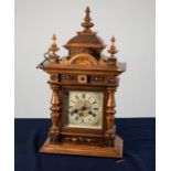 LATE 19th/EARLY 20th CENTURY GERMAN WALNUT CASED MANTEL CLOCK with Junghans movement striking on a