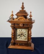 LATE 19th/EARLY 20th CENTURY GERMAN WALNUT CASED MANTEL CLOCK with Junghans movement striking on a