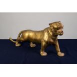 A TWENTIETH CENTURY HOLLOW CAST BRASS MODEL PROWLING TIGER, 28" (71cm) long