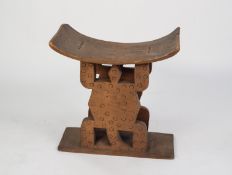 AFRICAN CARVED BLOND WOOD ASHANTI STOOL, of typical form, with standing lizard pattern supports, 22?