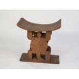 AFRICAN CARVED BLOND WOOD ASHANTI STOOL, of typical form, with standing lizard pattern supports, 22?