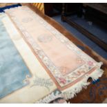 HEAVY QUALITY EMBOSSED WASHED CHINESE RUNNER, the plain peach coloured field decorated with two