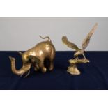 A TWENTIETH CENTURY HEAVY CAST BRASS MODEL ELEPHANT AND A CAST BRASS EAGLE on a tree stump (2)