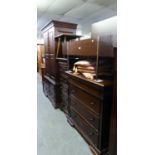 CONTINENTAL MAHOGANY BEDROOM SUITE COMPRISING A GARDEROBE WITH FOUR SHORT DRAWERS BELOW; A TALLBOY