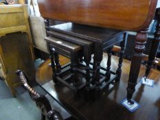 A NEST OF THREE OAK OBLONG COFFEE TABLES, OF JACOBEAN STYLE