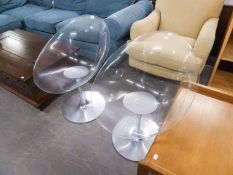 A PAIR OF CLEAR PLASTIC RETRO EGG CHAIRS