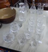 A HEAVY CUT GLASS SQUARE SPIRIT DECANTER AND STOPPER AND A SET OF 5 CUT GLASS SPIRIT TUMBLERS AND