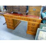 A GOOD QUALITY REPRODUCTION YEW-WOOD TWIN PEDESTAL DESK, WITH RED LEATHER INSET TOP WITH SINGLE
