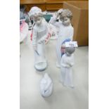 TWO NAO SPANISH PORCELAIN FIGURES OF CHILDREN, A BOY AND GIRL IN NIGHT ATTIRE, 11 ½? HIGH AND A