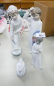 TWO NAO SPANISH PORCELAIN FIGURES OF CHILDREN, A BOY AND GIRL IN NIGHT ATTIRE, 11 ½? HIGH AND A