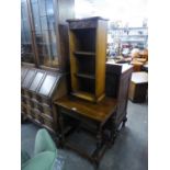 A SMALL CARVED OAK OPEN BOOKCASE AND AN OAK OBLONG OCCASIONAL TABLE, ON CARVED MELON BULB SUPPORTS