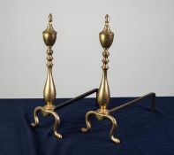 PAIR OF BRASS FIRE DOGS, each of baluster form with finial and scroll supports, 18 ¼? (46.4cm) high,